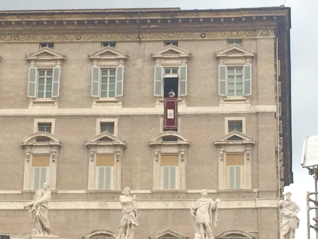 The Pope giving a Sunday blessing from a window.